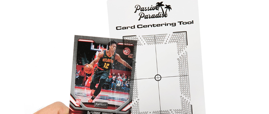 pre-grade-cards-at-home-using-a-centering-tool A photo of using a centering tool to pre-grade cards at home