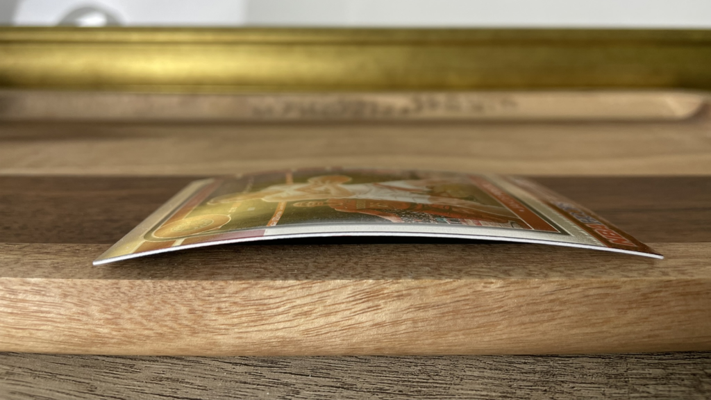 An example of a curved card for prevent sports cards from warping in high humidity